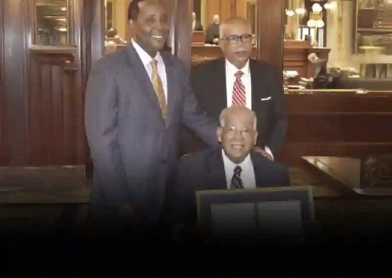 Senator Jackson with Dr. Latta Thomas and an award